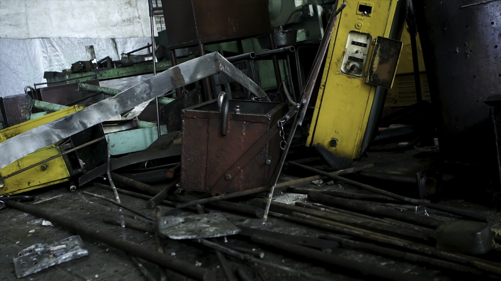 Abandoned old, useless details of machine tools in workshop, metal scrap. Many different parts of